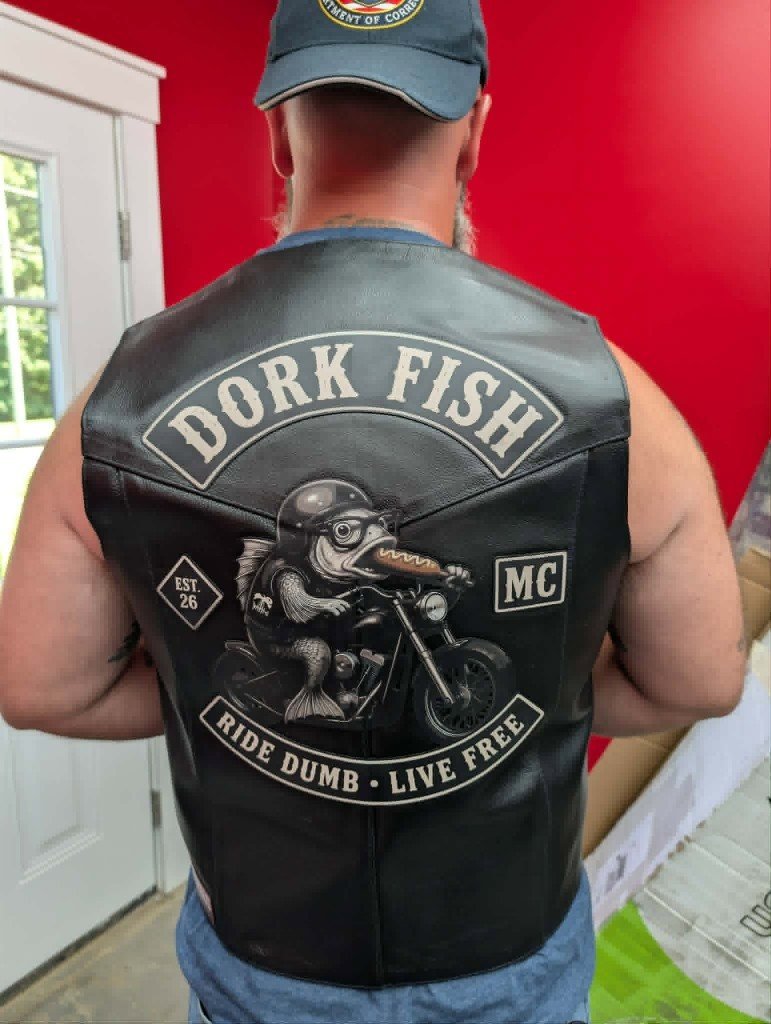 Dork Fish motorcycle club patches applied to a leather vest